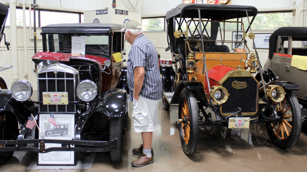 Chemical Valley region of the Antique and Classic car Club of Canada, One of our members at the John Smith Gilmour museum admiring sme of the beautiful CARS